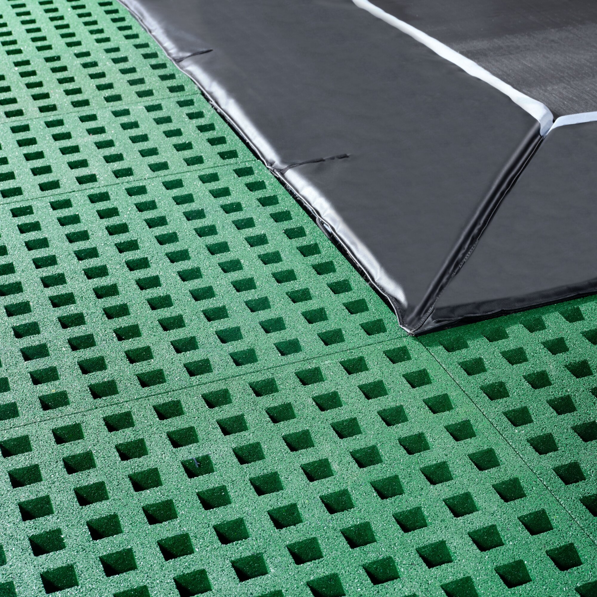 EXIT Dynamic ground level trampoline 275x458cm with Freezone safety tiles - black
